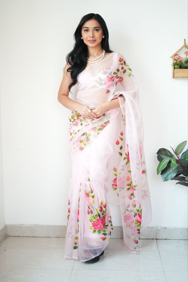 A georgette saree, characterized by its soft, delicate drape and subtle sheen, exudes understated elegance