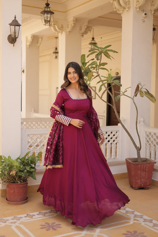 Adorn yourself in this opulent gown, where luxurious silk meets intricate embroidery, creating a silhouette that whispers sophistication and allure