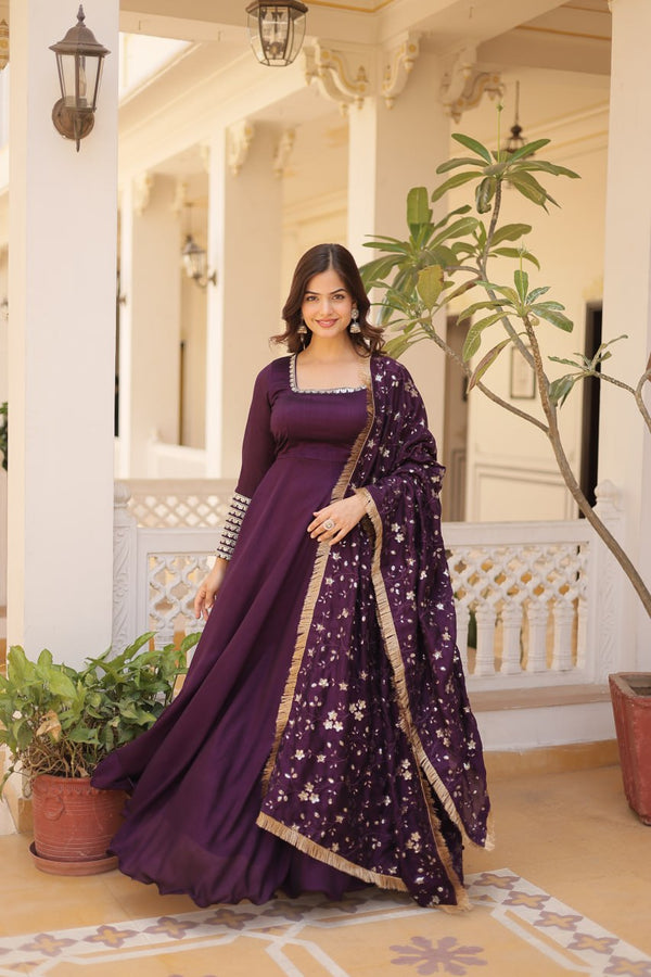 Adorn yourself in this opulent gown, where luxurious silk meets intricate embroidery, creating a silhouette that whispers sophistication and allure